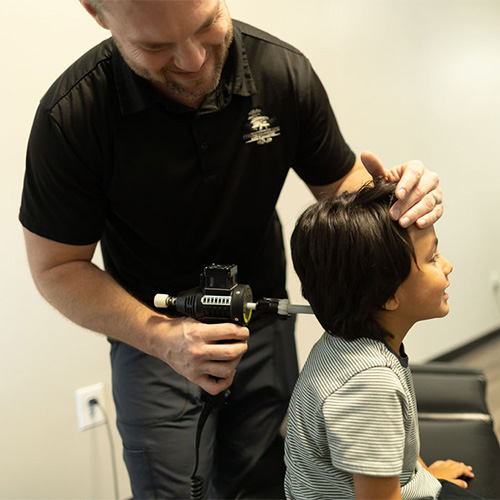 Chiropractor Winter Haven FL Aaron Verrett With Child