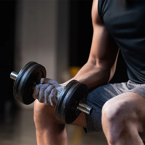 Chiropractic Winter Haven FL Man Curling A Dumbbell Chiropractic Winter Haven FL Man Curling A Dumbbell
