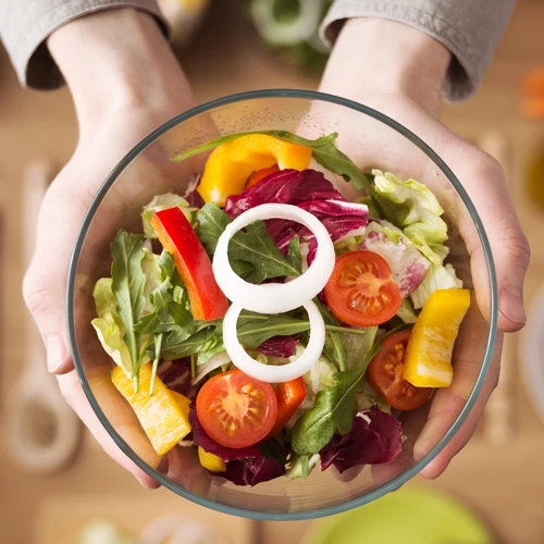 Chiropractic Winter Haven FL Woman Holding a Salad Chiropractic Winter Haven FL Woman Holding a Salad